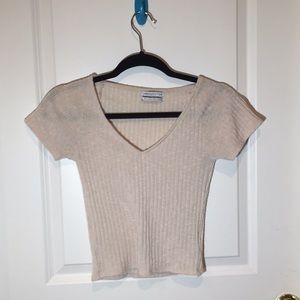 Cream colored knit tee shirt